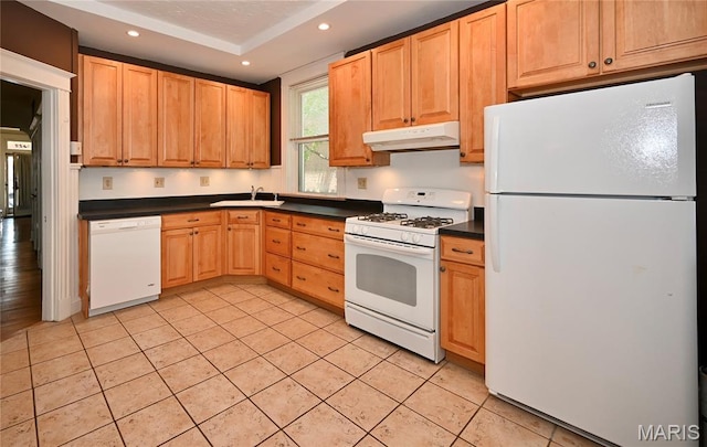 5322 Lansdowne Ave, Saint Louis, MO 63109 - kitchen with white appliances, under cabinet range hood, dark countertops, light tile patterned floors, and recessed lighting