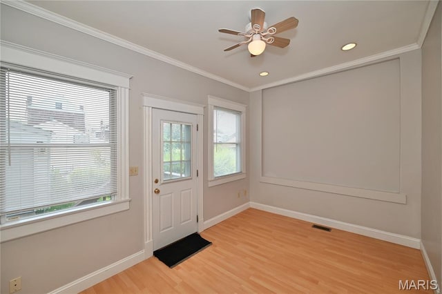 5322 Lansdowne Ave, Saint Louis, MO 63109 - doorway with light wood-style flooring, crown molding, ceiling fan, and recessed lighting