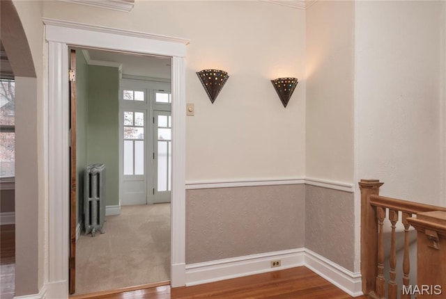 5322 Lansdowne Ave, Saint Louis, MO 63109 - hallway with radiator, ornamental molding, wood finished floors, and arched walkways
