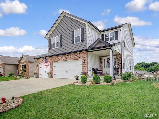 1050 Creekside Dr, Waterloo, IL 62298 - view of front of home featuring brick siding, driveway, a porch, and a garage
