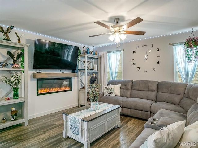 1050 Creekside Dr, Waterloo, IL 62298 - living room with a glass covered fireplace, dark wood-style flooring, and ceiling fan