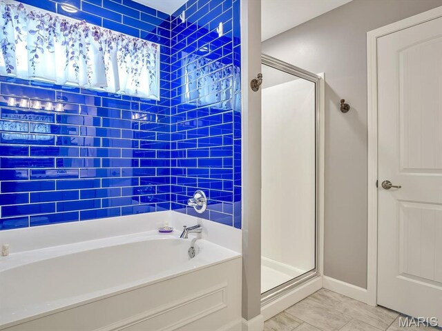 1050 Creekside Dr, Waterloo, IL 62298 - bathroom with a shower stall, a bath, and marble finish flooring