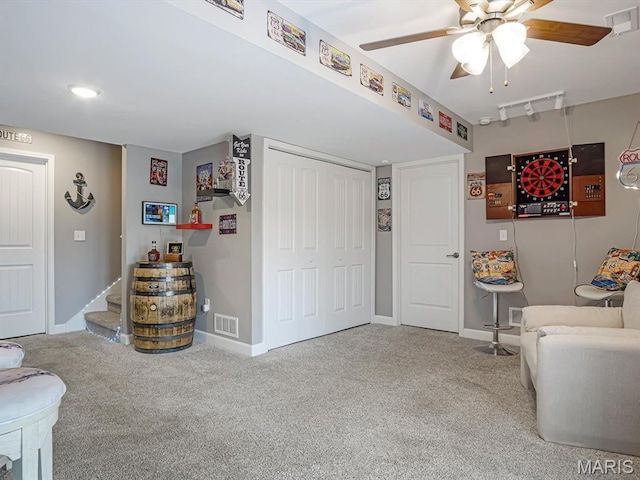 1050 Creekside Dr, Waterloo, IL 62298 - sitting room with carpet floors, a ceiling fan, and stairs