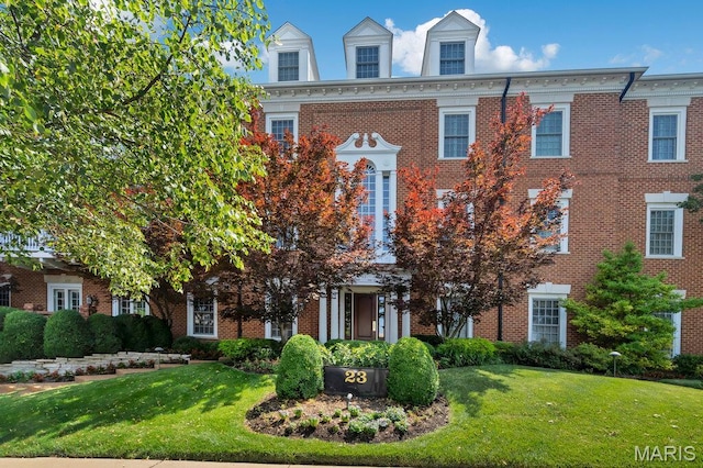 23 Topton Way Unit 2B, Clayton, MO 63105 - colonial-style house with a front lawn and brick siding