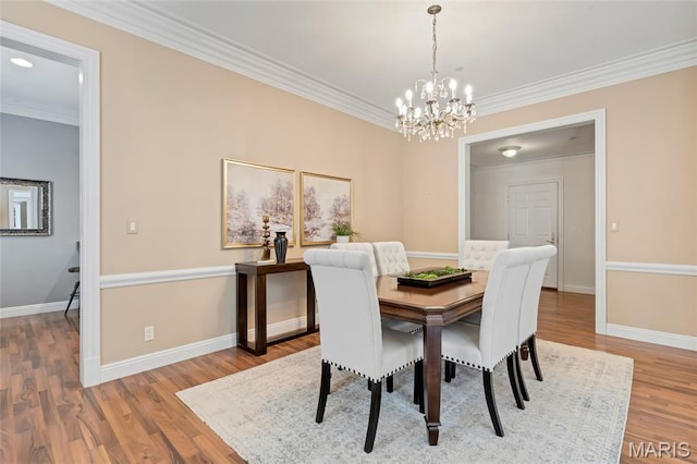 23 Topton Way Unit 2B, Clayton, MO 63105 - dining room featuring a chandelier, ornamental molding, and wood finished floors