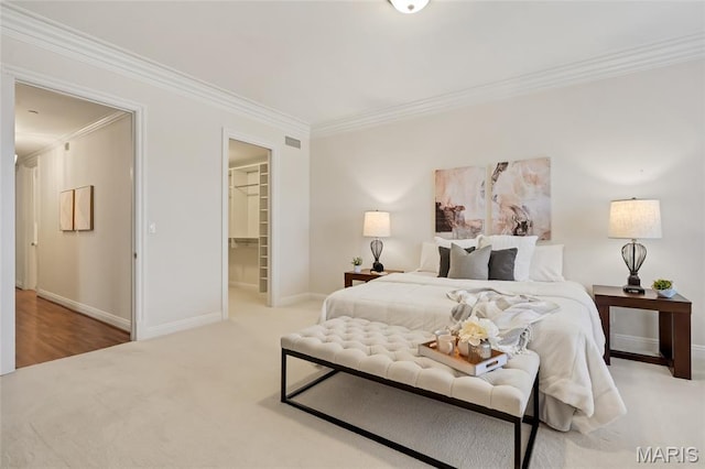 23 Topton Way Unit 2B, Clayton, MO 63105 - bedroom with ornamental molding, a spacious closet, a closet, and carpet