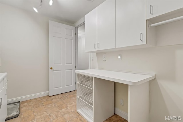 23 Topton Way Unit 2B, Clayton, MO 63105 - kitchen featuring light countertops and white cabinetry