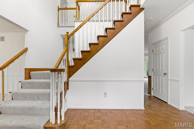 265 Timber Tree Ct, Wildwood, MO 63011 - stairway with crown molding and a high ceiling