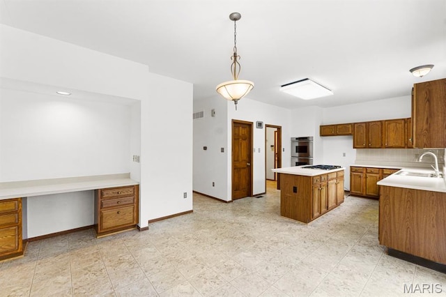 265 Timber Tree Ct, Wildwood, MO 63011 - kitchen with brown cabinets, gas stovetop, stainless steel double oven, light countertops, and a kitchen island