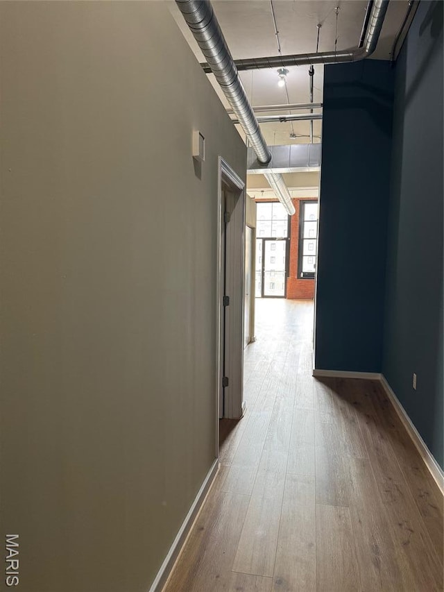 1520 Washington Ave Unit 617, Saint Louis, MO 63103 - hallway with wood-type flooring and baseboards