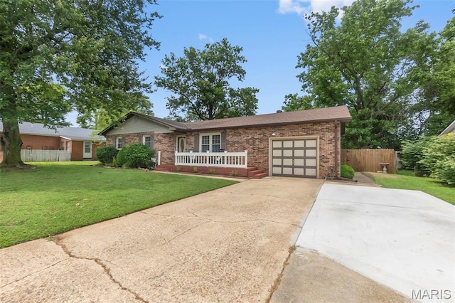 1004 Willow Ln, Sikeston, MO 63801 - single story home with a garage, driveway, brick siding, and covered porch