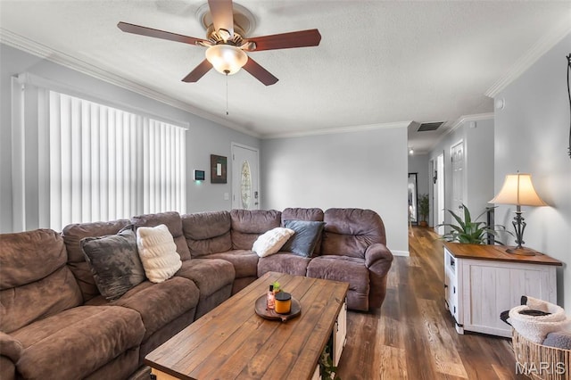 1004 Willow Ln, Sikeston, MO 63801 - living room with a ceiling fan, dark wood-type flooring, a textured ceiling, and crown molding