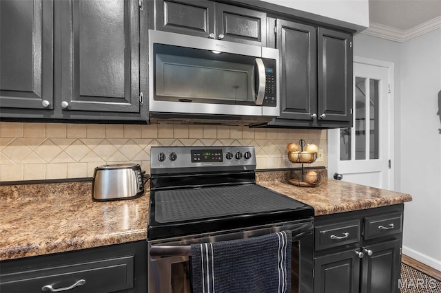 1004 Willow Ln, Sikeston, MO 63801 - kitchen with appliances with stainless steel finishes, dark cabinets, ornamental molding, backsplash, and wood finished floors