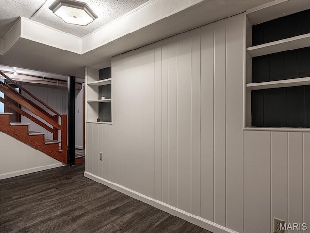 6417 Ruth Dr, Saint Louis, MO 63116 - finished basement with dark wood-type flooring, built in shelves, and stairs