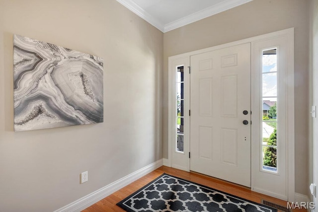 714 Oriental Lily Dr, Ofallon, MO 63366 - entryway featuring light wood finished floors and crown molding
