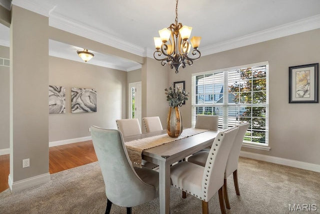 714 Oriental Lily Dr, Ofallon, MO 63366 - dining area with a chandelier, crown molding, and light colored carpet