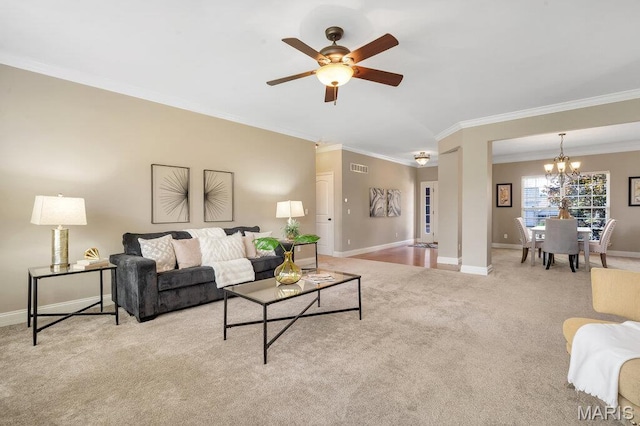 714 Oriental Lily Dr, Ofallon, MO 63366 - living area featuring a chandelier, ornamental molding, carpet flooring, and a ceiling fan