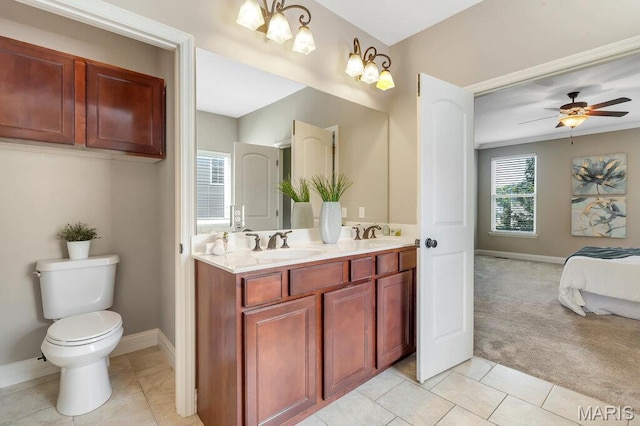 714 Oriental Lily Dr, Ofallon, MO 63366 - bathroom featuring double vanity, tile patterned floors, ceiling fan, and ensuite bath