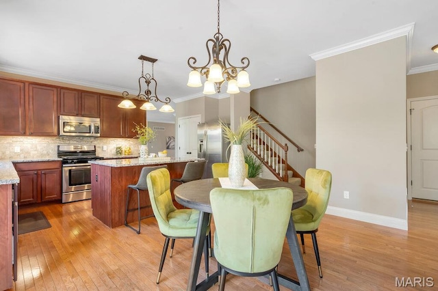 714 Oriental Lily Dr, Ofallon, MO 63366 - dining space featuring light wood-type flooring, stairway, crown molding, and a chandelier