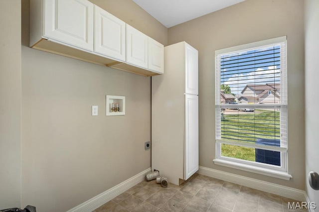 714 Oriental Lily Dr, Ofallon, MO 63366 - laundry area with hookup for an electric dryer, cabinet space, plenty of natural light, and washer hookup
