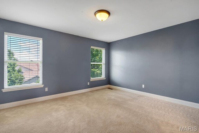 714 Oriental Lily Dr, Ofallon, MO 63366 - empty room featuring carpet and baseboards