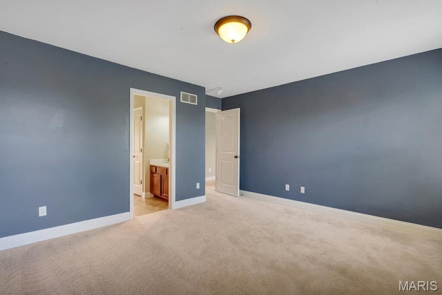 714 Oriental Lily Dr, Ofallon, MO 63366 - unfurnished bedroom with light colored carpet and connected bathroom