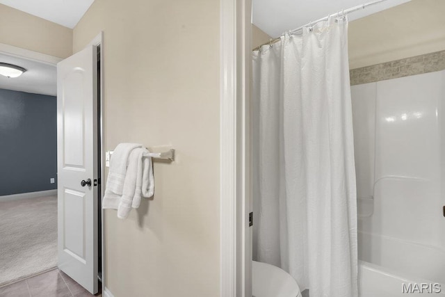 714 Oriental Lily Dr, Ofallon, MO 63366 - bathroom featuring shower / bath combo and tile patterned floors