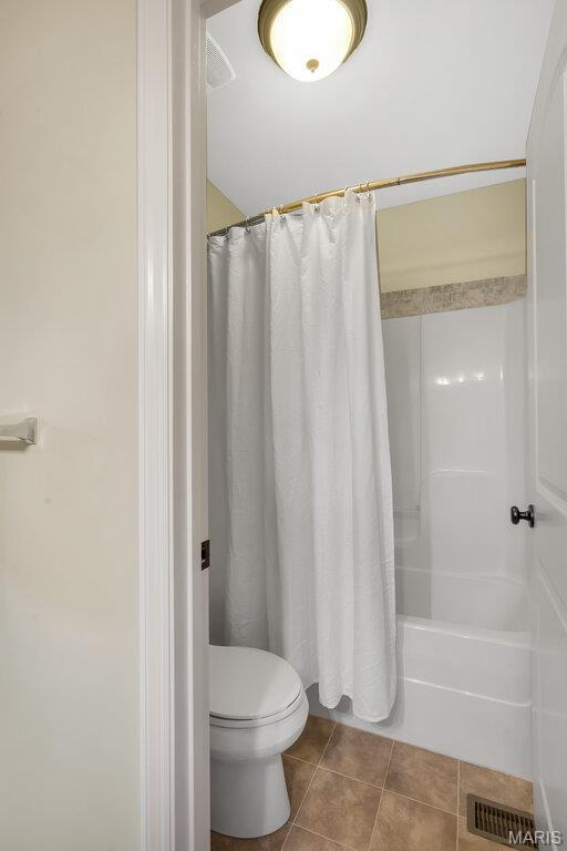 714 Oriental Lily Dr, Ofallon, MO 63366 - bathroom with tile patterned floors and shower / bath combo