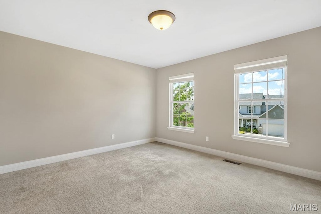 714 Oriental Lily Dr, Ofallon, MO 63366 - spare room with baseboards and light colored carpet