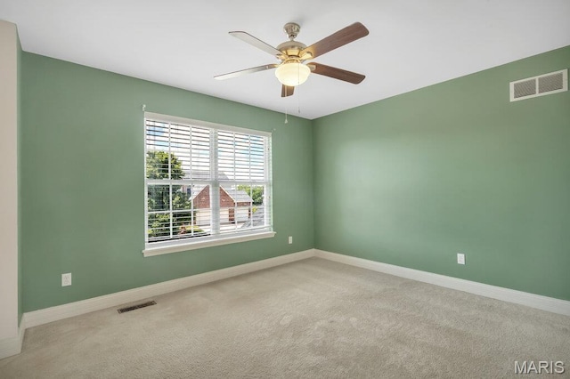 714 Oriental Lily Dr, Ofallon, MO 63366 - carpeted spare room featuring baseboards and a ceiling fan
