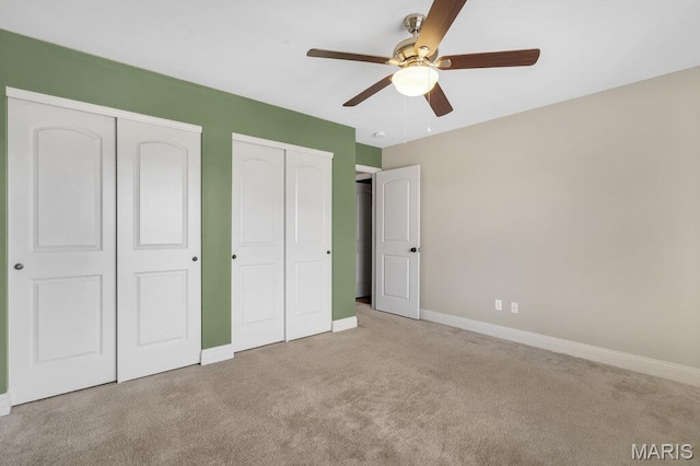 714 Oriental Lily Dr, Ofallon, MO 63366 - unfurnished bedroom with carpet flooring, multiple closets, and a ceiling fan