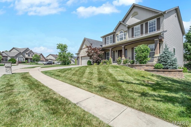 714 Oriental Lily Dr, Ofallon, MO 63366 - view of front of property with a garage, a front yard, and a residential view
