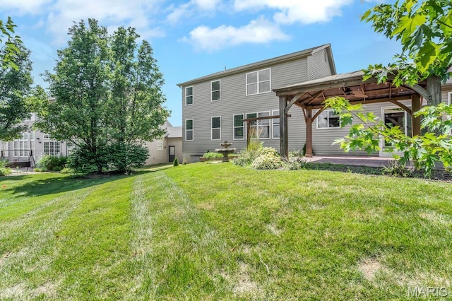 714 Oriental Lily Dr, Ofallon, MO 63366 - rear view of house featuring a gazebo and a yard