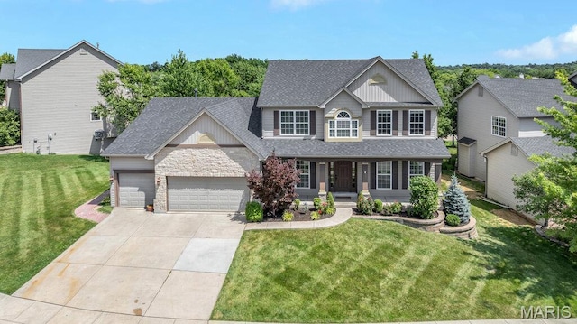 714 Oriental Lily Dr, Ofallon, MO 63366 - craftsman inspired home with a garage, a porch, driveway, a front lawn, and roof with shingles