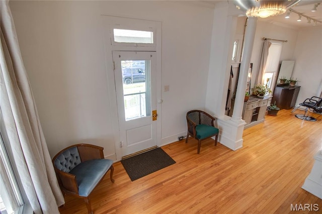 408 N N Main St, Carrollton, IL 62016 - entrance foyer featuring light wood-style floors, ornamental molding, and a chandelier