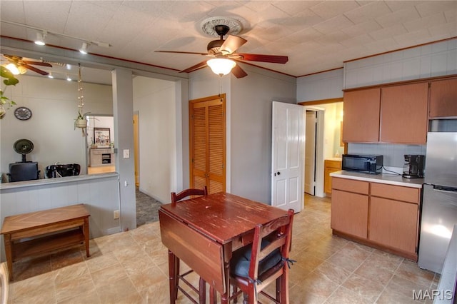 408 N N Main St, Carrollton, IL 62016 - kitchen with a ceiling fan, freestanding refrigerator, light countertops, black microwave, and track lighting