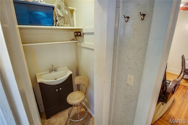 408 N N Main St, Carrollton, IL 62016 - bathroom with vanity and wood finished floors