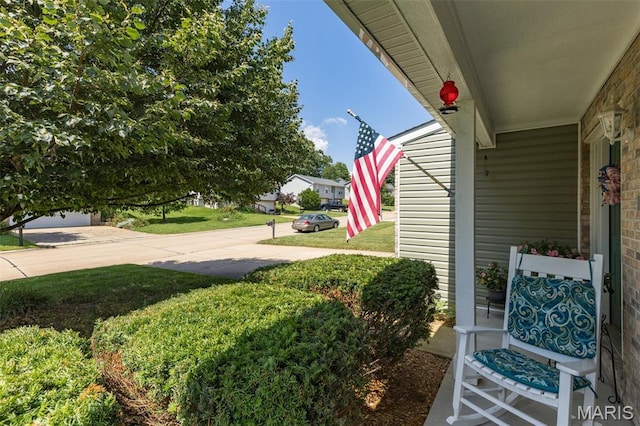 24 Adventura Dr, Festus, MO 63028 - view of green lawn featuring a porch