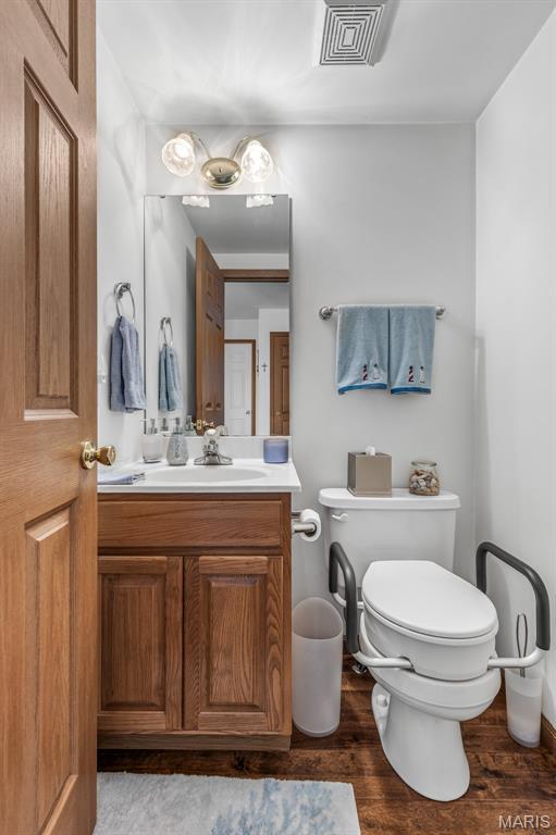 24 Adventura Dr, Festus, MO 63028 - half bath featuring vanity and wood finished floors