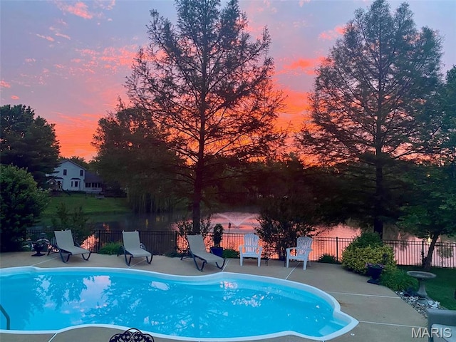 958 Kinsale Dr, Manchester, MO 63021 - pool at dusk featuring a patio