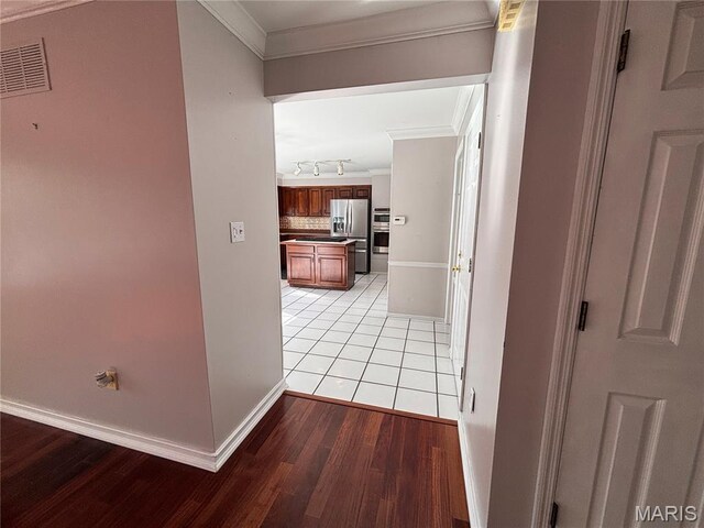 958 Kinsale Dr, Manchester, MO 63021 - hall with ornamental molding, light wood-type flooring, and track lighting