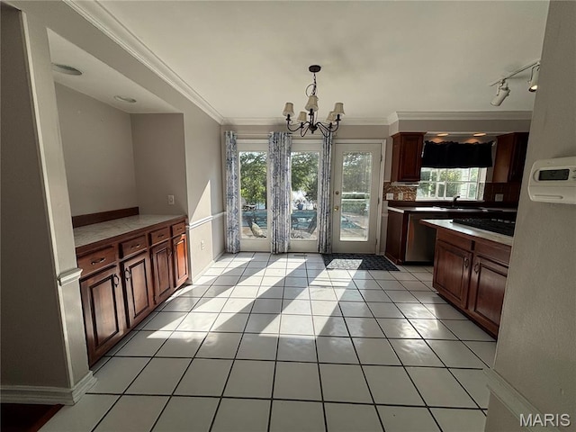 958 Kinsale Dr, Manchester, MO 63021 - unfurnished dining area with a chandelier, light tile patterned floors, and ornamental molding