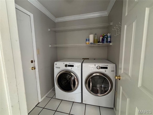 958 Kinsale Dr, Manchester, MO 63021 - laundry area featuring ornamental molding, washing machine and clothes dryer, and light tile patterned flooring