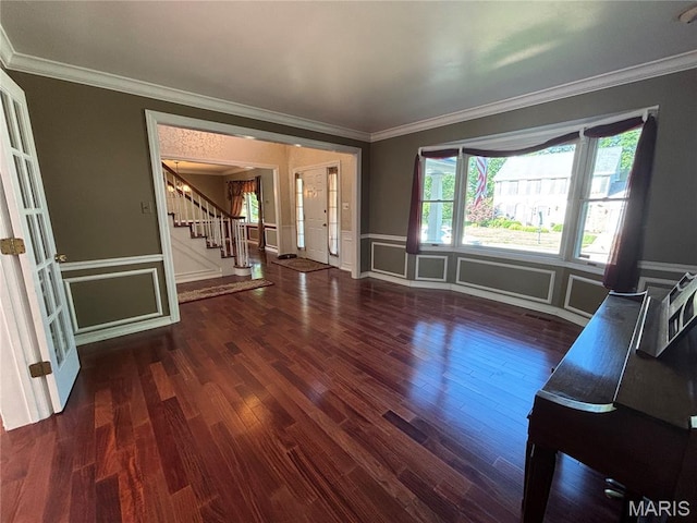 958 Kinsale Dr, Manchester, MO 63021 - unfurnished living room with stairway, wood finished floors, crown molding, a decorative wall, and a wainscoted wall