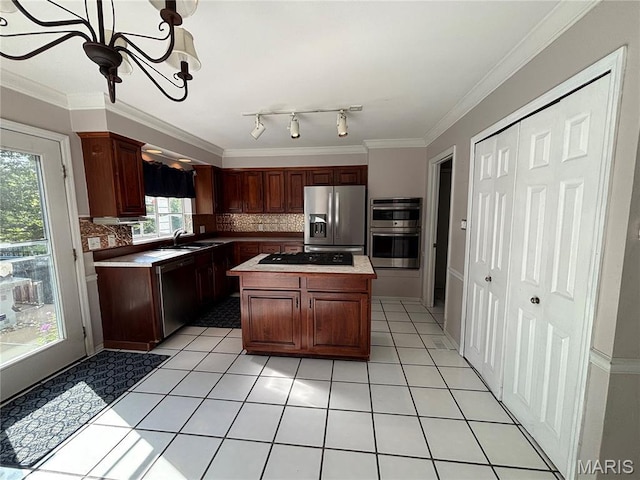 958 Kinsale Dr, Manchester, MO 63021 - kitchen featuring stainless steel appliances, tasteful backsplash, light tile patterned flooring, light countertops, and crown molding