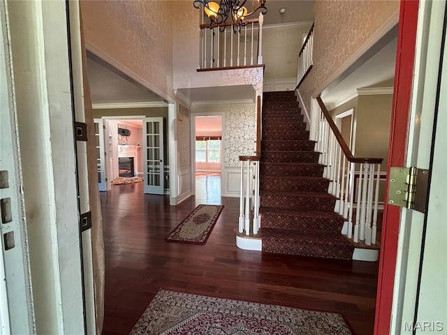 958 Kinsale Dr, Manchester, MO 63021 - foyer entrance with crown molding, wood finished floors, a high ceiling, stairway, and a chandelier