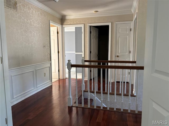 958 Kinsale Dr, Manchester, MO 63021 - hallway with dark wood-style floors, a wainscoted wall, ornamental molding, an upstairs landing, and a decorative wall