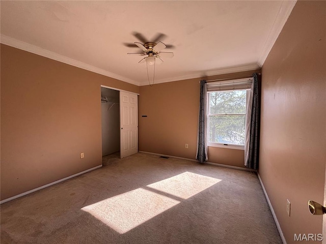 958 Kinsale Dr, Manchester, MO 63021 - unfurnished bedroom with carpet, crown molding, a closet, and a ceiling fan
