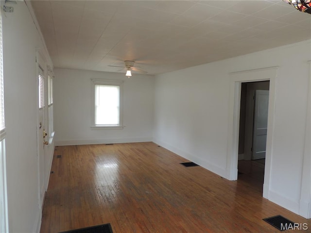 1203 E Jackson St, Mexico, MO 65265 - spare room featuring hardwood / wood-style flooring and ceiling fan