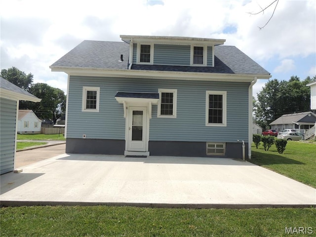 1203 E Jackson St, Mexico, MO 65265 - rear view of house featuring a yard, roof with shingles, and a patio area